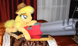 Size: 1980x1174 | Tagged: safe, artist:ponimalion, character:applejack, species:pony, badass, bed, bedroom eyes, clothing, female, freckles, hat, irl, life size, lying down, mare, photo, plushie, quake 3 arena, rocket launcher, weapon