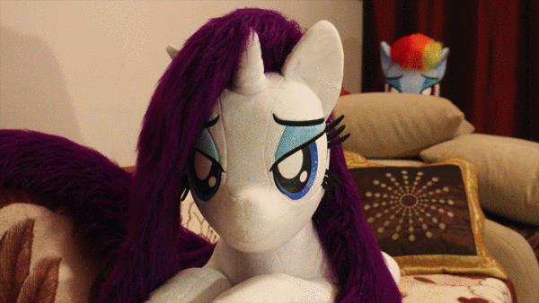 Size: 600x338 | Tagged: safe, artist:ponimalion, character:rainbow dash, character:rarity, ship:raridash, animated, bed, bedroom eyes, duo, duo female, female, heart, heart pillow, irl, jumping, lesbian, life size, photo, pillow, plushie, shipping, youtube, youtube link
