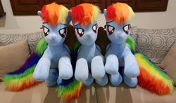 Size: 2788x1639 | Tagged: safe, artist:ponimalion, character:rainbow dash, species:pegasus, species:pony, bed, dashstorm, female, folded wings, irl, life size, mare, multeity, photo, plushie, ponidox, rainbow dash is excited, self ponidox, triality, wings