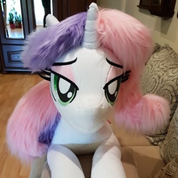 Size: 1355x1355 | Tagged: safe, artist:ponimalion, character:sweetie belle, species:pony, species:unicorn, bed, female, irl, life size, mare, older, older sweetie belle, photo, plushie, prone