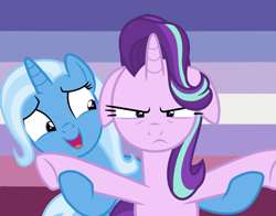Size: 1010x791 | Tagged: safe, artist:lynmunn, character:starlight glimmer, character:trixie, species:pony, ship:startrix, female, floppy ears, lesbian, lesbian pride flag, shipping, trixie's puppeteering