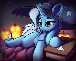 Size: 1836x1483 | Tagged: safe, artist:hitbass, character:trixie, species:pony, species:unicorn, g4, book, candy, clothing, female, food, halloween, hat, holiday, jack-o-lantern, lidded eyes, lying down, mare, prone, pumpkin, solo, trixie's hat, witch hat