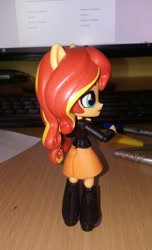 Size: 768x1262 | Tagged: safe, artist:artofmagicpoland, derpibooru original, character:sunset shimmer, my little pony:equestria girls, boots, clothing, doll, equestria girls minis, female, irl, jacket, leather jacket, looking at you, phone, photo, pinup, sexy, shoes, skirt, sultry pose, toy