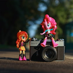 Size: 3640x3640 | Tagged: safe, artist:artofmagicpoland, character:pinkie pie, character:sunset shimmer, ship:sunsetpie, my little pony:equestria girls, 35mm camera, doll, equestria girls minis, eqventures of the minis, female, lesbian, shipping, sitting, slr, toy, zenit