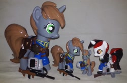 Size: 2293x1509 | Tagged: safe, artist:gryphyn-bloodheart, oc, oc only, oc:blackjack, oc:littlepip, species:pony, species:unicorn, fallout equestria, fallout equestria: project horizons, blind bag, clothing, custom, fanfic, female, funko, gun, handgun, hooves, horn, irl, little macintosh, mare, mystery mini, optical sight, photo, pipbuck, revolver, saddle bag, toy, vault suit, weapon