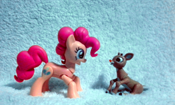 Size: 1600x960 | Tagged: safe, artist:kuren247, character:pinkie pie, species:deer, species:earth pony, species:pony, species:reindeer, action figure, crossover, figurine, irl, merry christmas, photo, rankin/bass, rudolph the red nosed reindeer, sitting, toy, tribute