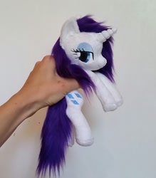 Size: 1510x1725 | Tagged: safe, artist:epicrainbowcrafts, character:rarity, beanie (plushie), fluffy, hand, irl, lidded eyes, photo, plushie, solo