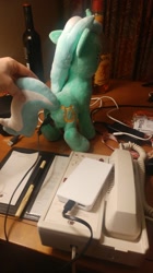 Size: 744x1328 | Tagged: safe, artist:onlyfactory, character:lyra heartstrings, species:pony, anker, battery, bootleg, charger, irl, lyra plushie, photo, plothole plush lyra, plushie