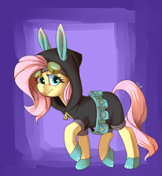 Size: 1200x1300 | Tagged: safe, artist:passigcamel, character:fluttershy, species:pony, belt, bunny ears, clothing, costume, dangerous mission outfit, female, goggles, hoodie, looking at you, mare, raised hoof, smiling, solo, utility belt
