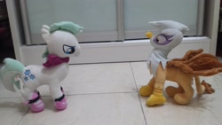 Size: 4128x2322 | Tagged: safe, artist:onlyfactory, photographer:horsesplease, character:double diamond, character:gilda, species:griffon, species:pony, bootleg, confrontation, irl, photo, plushie