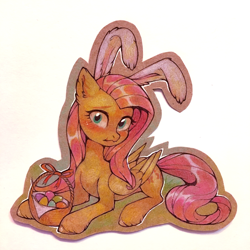 Size: 1000x1000 | Tagged: safe, artist:lispp, character:fluttershy, species:pegasus, species:pony, basket, blushing, bunny ears, cute, ear fluff, easter, easter basket, easter egg, female, folded wings, head turn, holiday, looking at you, mare, prone, shy, shyabetes, solo, traditional art, wings