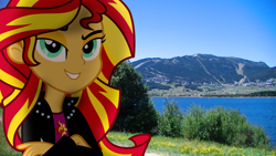 Size: 3840x2160 | Tagged: safe, artist:bastbrushie, character:sunset shimmer, species:human, my little pony:equestria girls, blue sky, clothing, crossed arms, cutie mark on clothes, equestria girls in real life, female, france, grin, irl, jacket, mountain, photo, ponies in real life, smiling, solo, town, tree, vector