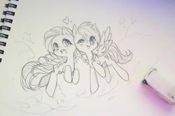 Size: 1200x797 | Tagged: safe, artist:odaefnyo, character:fluttershy, character:rainbow dash, species:pegasus, species:pony, ship:flutterdash, blushing, cute, eraser, female, flying, grayscale, heart, lesbian, mare, monochrome, pencil drawing, shipping, sketch, spread wings, traditional art, wings