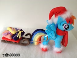 Size: 3264x2448 | Tagged: safe, artist:valio99999, character:rainbow dash, christmas, clothing, hat, irl, photo, plushie, santa hat, sleigh, solo