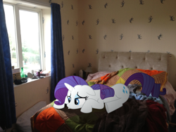Size: 3264x2448 | Tagged: safe, artist:pangbot, character:rarity, species:pony, species:unicorn, bedroom, floppy ears, high res, irl, photo, ponies in real life, pouting, prone, sad, solo, underhoof, vector