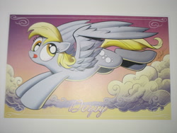 Size: 2592x1944 | Tagged: safe, artist:andypriceart, character:derpy hooves, species:pegasus, species:pony, cloud, derp, female, flying, looking at you, mare, poster, print, sky, smiling, solo, tongue out, vienna comic con