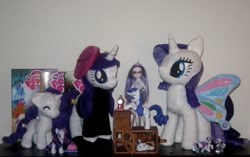 Size: 1436x901 | Tagged: artist needed, safe, idw, character:rarity, comic book, irl, photo, plushie, raricorn, shrine, toy
