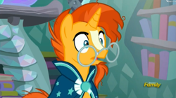 Size: 1649x921 | Tagged: safe, screencap, character:sunburst, species:pony, species:unicorn, episode:the crystalling, g4, my little pony: friendship is magic, clothing, discovery family logo, glasses, male, reaction image, robe, solo, stallion, sunburst's glasses, sunburst's robe, surprised