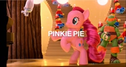 Size: 1351x721 | Tagged: safe, screencap, character:pinkie pie, species:pony, brushable, commercial, guy diamond, irl, lego, michelangelo, photo, pony reference, rearing, target (store), teenage mutant ninja turtles, text, the toycracker, toy, toy soldier, trolls, youtube link