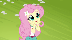 Size: 1280x720 | Tagged: safe, screencap, character:fluttershy, equestria girls:legend of everfree, g4, my little pony:equestria girls, camp everfree outfits, clothing, cute, dawwww, female, flower, open mouth, shorts, shyabetes, sleeveless, solo, tank top
