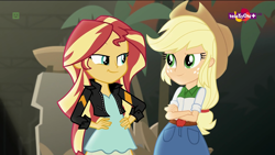 Size: 1920x1080 | Tagged: safe, screencap, character:applejack, character:sunset shimmer, equestria girls:movie magic, g4, my little pony:equestria girls, clothing, cowboy hat, faec, freckles, hand on hip, hat, jacket, leather jacket, looking at each other, plant, smiling, smug, smugset shimmer, teletoon