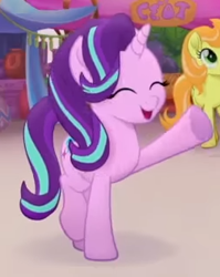 Size: 251x315 | Tagged: safe, screencap, character:cantaloupe, character:starlight glimmer, species:earth pony, species:pony, species:unicorn, my little pony: the movie (2017), background pony, cropped, cute, eyes closed, female, glimmerbetes, happy, heart, hoof heart, mare, open mouth, raised hoof, raised leg, smiling, solo focus, trailer, underhoof, waving