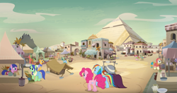 Size: 1273x670 | Tagged: safe, screencap, character:a.k. yearling, character:daring do, character:desert flower, character:nephthys, character:nile faras, character:pepperberry (g4), character:pinkie pie, character:rainbow dash, character:taperet, species:earth pony, species:pegasus, species:pony, species:unicorn, episode:daring done, architecture, aten (character), background pony, cactus fruit, ear clip, elderly, female, glasses, hijab, iahjmehet, lunar bay, male, mare, market, pyramid, raised hoof, scenery, somnambula (location), somnambula resident, stallion, tail wrap, tut jannah, unnamed pony, village, well