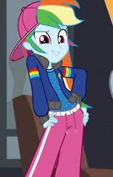Size: 457x720 | Tagged: safe, screencap, character:rainbow dash, episode:get the show on the road, eqg summertime shorts, g4, my little pony:equestria girls, backwards ballcap, baseball cap, cap, clothing, cropped, hand on hip, hat, jacket, pants, rapper dash, sexy, smiling, zoomed in