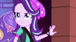 Size: 1280x718 | Tagged: safe, screencap, character:starlight glimmer, equestria girls:mirror magic, g4, my little pony:equestria girls, beanie, clothing, determined, female, hat, shoulder bag, solo, vest, watch