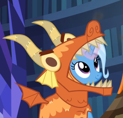Size: 702x672 | Tagged: safe, screencap, character:trixie, species:pony, species:unicorn, episode:uncommon bond, g4, my little pony: friendship is magic, board game, clothing, costume, cute, diatrixes, dragon costume, dragon pit, female, glowing horn, looking up, mare, smiling, solo