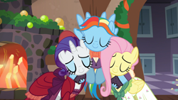 Size: 1920x1080 | Tagged: safe, screencap, character:fluttershy, character:rainbow dash, character:rarity, species:pegasus, species:pony, species:unicorn, episode:a hearth's warming tail, g4, my little pony: friendship is magic, clothing, dress, eyes closed, female, flutterholly, hug, mare, merry, rainbow dash always dresses in style, snowdash
