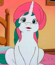 Size: 455x540 | Tagged: safe, screencap, character:baby gusty, species:pony, species:unicorn, episode:the ghost of paradise estate, g1, my little pony 'n friends, bed, cropped, pillow, pillow hat, solo
