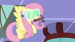 Size: 1280x720 | Tagged: safe, screencap, character:fluttershy, species:pegasus, species:pony, episode:discordant harmony, g4, my little pony: friendship is magic, eyes closed, flying, goggles, hammer, mouth hold, nail, safety goggles, solo