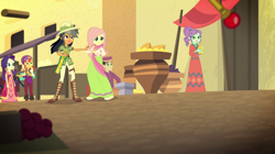 Size: 1912x1072 | Tagged: safe, screencap, character:crystal lullaby, character:daring do, character:fluttershy, character:rarity, character:sunset shimmer, equestria girls:movie magic, g4, my little pony:equestria girls, background human, chestnut magnifico, clothing, dress, female, hat, india movie set, macuahuitl, pith helmet, robe, sari, sunshim, sword of altoriosa, sword of lusitano