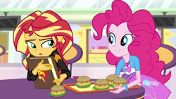 Size: 1280x720 | Tagged: safe, screencap, character:pinkie pie, character:sunset shimmer, equestria girls:mirror magic, g4, my little pony:equestria girls, book, bracelet, burger, chair, discovery family logo, food, geode of empathy, geode of sugar bombs, hamburger, jewelry, journal, looking at each other, magical geodes, smiling, storefront, table, television, tray