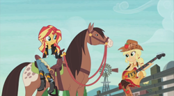 Size: 854x470 | Tagged: safe, screencap, character:applejack, character:sunset shimmer, episode:friendship through the ages, equestria girls:rainbow rocks, g4, my little pony:equestria girls, country applejack, guitar, horse, humans riding horses, lonestar, riding, sitting, sleeveless, smiling
