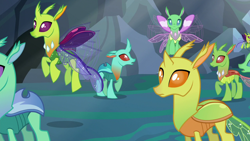 Size: 1280x720 | Tagged: safe, screencap, species:changeling, species:reformed changeling, episode:to where and back again, g4, my little pony: friendship is magic, background changeling, changeling kingdom, clypeus, cornicle, flying