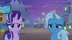 Size: 1280x720 | Tagged: safe, screencap, character:hoo'far, character:starlight glimmer, character:trixie, species:pony, species:unicorn, episode:on the road to friendship, building, female, glowpaz, male, mare, night, saddle arabian, somnambula (location), stallion
