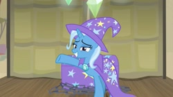 Size: 1255x706 | Tagged: safe, screencap, character:trixie, species:pony, species:unicorn, episode:on the road to friendship, cape, chest, clothing, female, grin, hat, mare, raised hoof, smiling, solo, stage, trixie's cape, trixie's hat