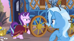 Size: 1280x720 | Tagged: safe, screencap, character:starlight glimmer, character:trixie, species:pony, species:unicorn, episode:on the road to friendship, clothing, crying, duo, duo female, female, hoo'far's wagon, mare, messy mane, robe, teary eyes, tree branch, wagon