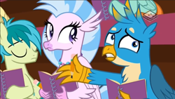 Size: 1066x600 | Tagged: safe, screencap, character:gallus, character:sandbar, character:silverstream, species:earth pony, species:griffon, species:hippogriff, species:pony, episode:the end in friend, g4, my little pony: friendship is magic, boomerang (tv channel), confused, eyes closed, female, male, notebook, notepad, pencil, teenager, trio, youtube link