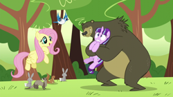 Size: 1280x720 | Tagged: safe, screencap, character:fluttershy, character:harry, character:starlight glimmer, species:pegasus, species:pony, species:rabbit, species:unicorn, episode:the cutie re-mark, animal, bear, bear hug, blue jay, female, flying, forest, hug, mare, s5 starlight, squirrel