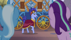 Size: 1280x720 | Tagged: safe, screencap, character:hoo'far, character:starlight glimmer, character:trixie, species:pony, species:unicorn, episode:on the road to friendship, clothing, female, goggles, male, mare, raised hoof, robe, saddle arabian, solo focus, stallion