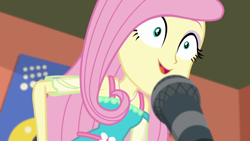 Size: 1280x720 | Tagged: safe, screencap, character:fluttershy, episode:fluttershy's butterflies, g4, my little pony:equestria girls, announcer, excited, female, fluttershy's butterflies: rainbow dash, football, geode of fauna, magical geodes, microphone, smiling, solo, sports, wide eyes