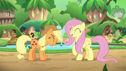 Size: 1280x720 | Tagged: safe, screencap, character:applejack, character:autumn afternoon, character:fern flare, character:fluttershy, character:forest fall, character:maple brown, character:pumpkin smoke, species:earth pony, species:kirin, species:pegasus, species:pony, episode:sounds of silence, g4, my little pony: friendship is magic, background kirin, bucket, duo focus, eyes closed, female, fountain, kirin village, laughing, male, mare, raised hoof, sitting, water