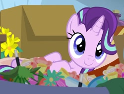 Size: 1278x969 | Tagged: safe, screencap, character:starlight glimmer, species:pony, species:unicorn, episode:on the road to friendship, c:, cute, cute face, dawwww, flower, glimmerbetes, hammock, lying down, smiling, solo