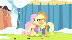 Size: 1920x1080 | Tagged: safe, screencap, character:applejack, character:fluttershy, species:earth pony, species:pegasus, species:pony, episode:best gift ever, g4, my little pony: friendship is magic, cheek squish, clothing, female, hug, mare, rainbow falls (location), scarf, side hug, snow, squishy cheeks, sweater