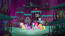 Size: 1440x810 | Tagged: safe, screencap, character:applejack, character:chimera sisters, character:fluttershy, character:pinkie pie, character:rainbow dash, character:rarity, character:snowbutt mctwinkles, character:spike, character:twilight sparkle, character:twilight sparkle (alicorn), species:alicorn, species:chimera, species:dragon, species:earth pony, species:pegasus, species:pony, species:unicorn, episode:school raze, g4, my little pony: friendship is magic, background monster, bugbear, cage, female, flish, male, mane seven, mane six, manticore, mare, maulwurf, monster, multiple heads, tartarus, three heads, winged spike, yeti
