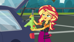 Size: 1920x1080 | Tagged: safe, screencap, character:sunset shimmer, episode:driving miss shimmer, g4, my little pony:equestria girls, apple jack (tool), car, driving miss shimmer: applejack, pun, solo, visual gag