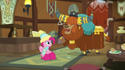Size: 1280x720 | Tagged: safe, screencap, character:pinkie pie, character:prince rutherford, species:earth pony, species:pony, species:yak, episode:best gift ever, g4, my little pony: friendship is magic, clothing, cloven hooves, crown, duo, ear piercing, earring, female, hair over eyes, hat, horn ring, house, jewelry, male, mare, open mouth, piercing, raised hoof, regalia, scarf, toque